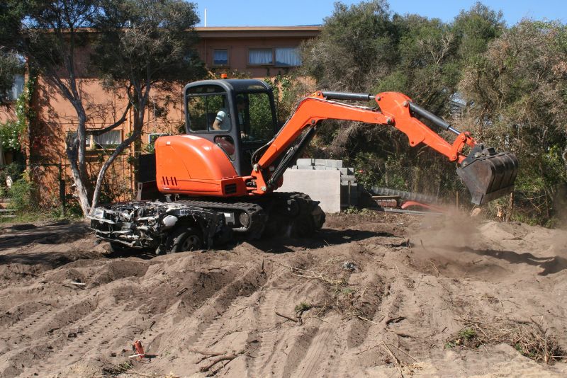 excavator clearing land