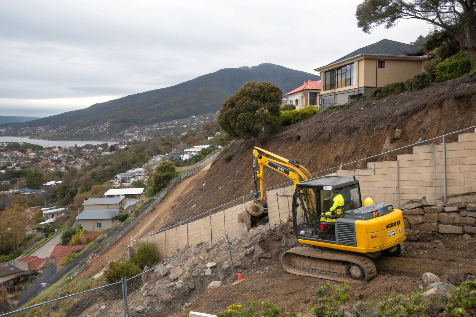Steep slope excavation equipment South Hobart hillside demolition